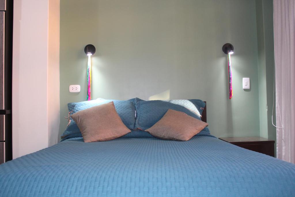 Postel nebo postele na pokoji v ubytování Hotel Incas Suite, con Aguas Termomedicinales