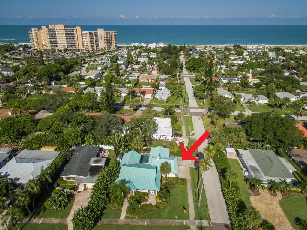 an aerial view of a house with a red arrow at Clearwater Beach Splendor - Weekly Beach Rental in Clearwater Beach