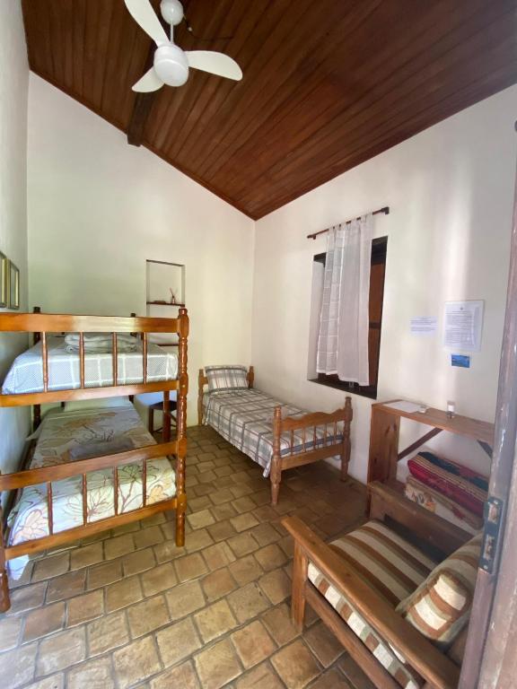 Postel nebo postele na pokoji v ubytování Pousada Caminho do Vale Guiné