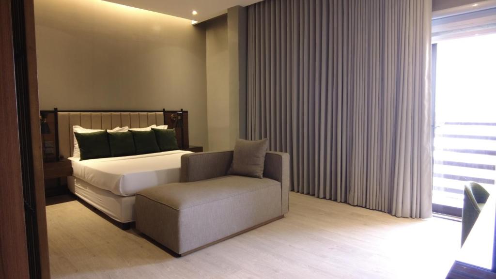 Postel nebo postele na pokoji v ubytování Acro Residences