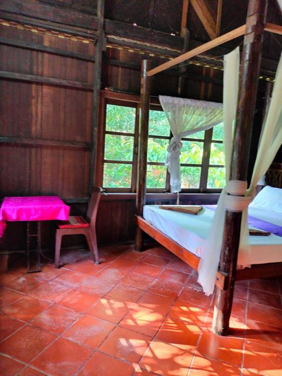 Postel nebo postele na pokoji v ubytování Jungle House Kep