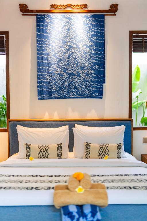 Postel nebo postele na pokoji v ubytování The Peacock Room Ubud