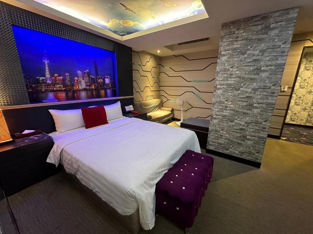 Postel nebo postele na pokoji v ubytování Wecity Hotel 薇城精緻旅店
