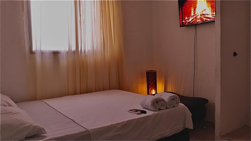 Postel nebo postele na pokoji v ubytování Hostal Viva Mar