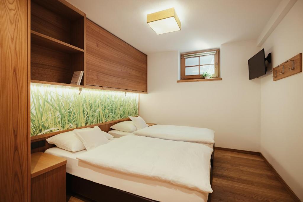 Posteľ alebo postele v izbe v ubytovaní Hotel Grien