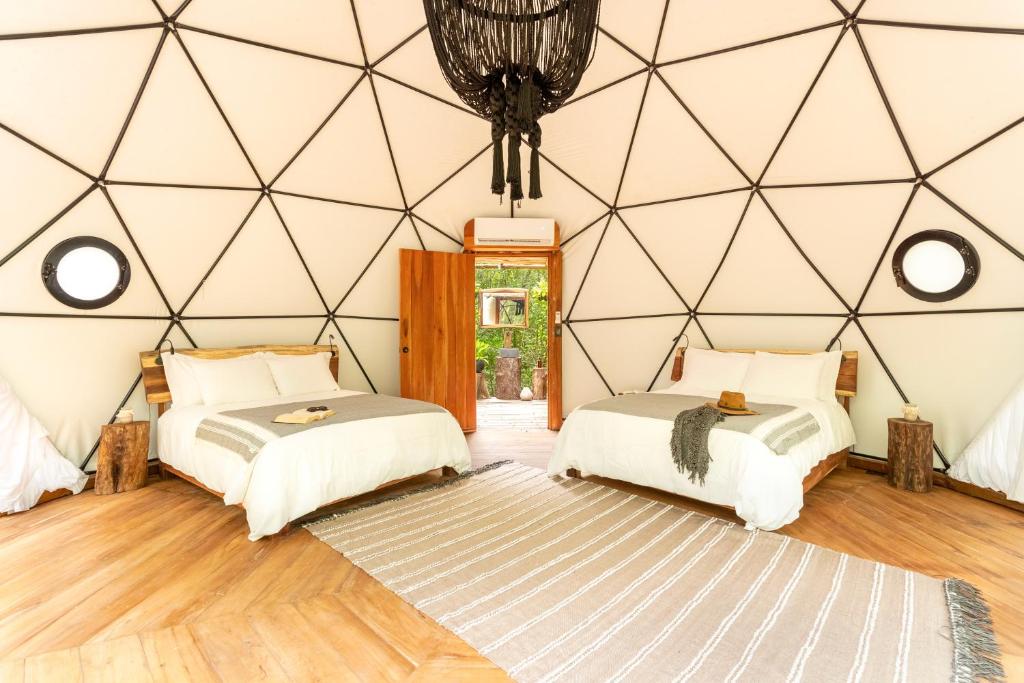Postel nebo postele na pokoji v ubytování Amaite Retreat Tulúm