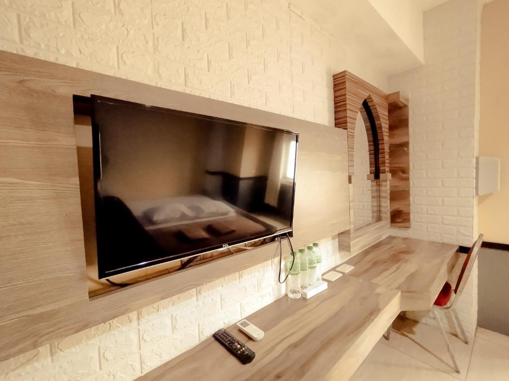 TV a/nebo společenská místnost v ubytování Hotel Syariah Larismanis
