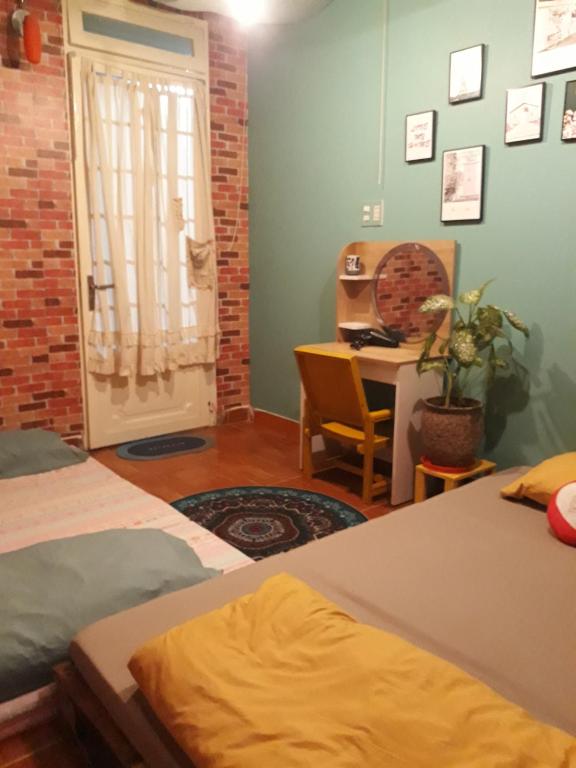 Giường trong phòng chung tại Ở Mô Dalat