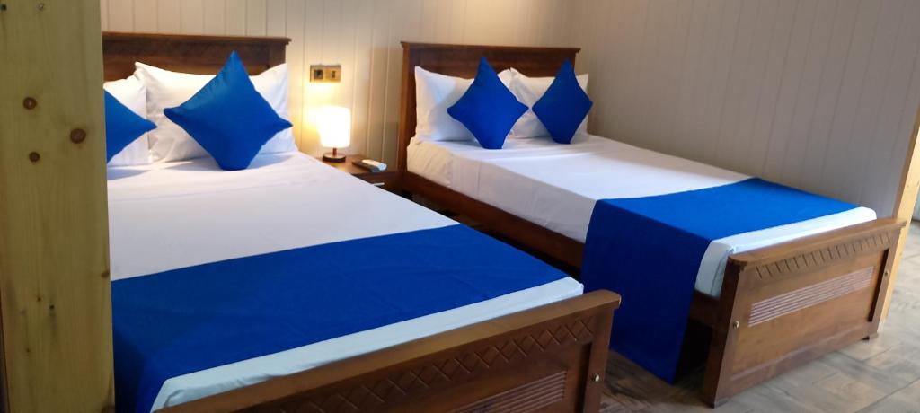 Postel nebo postele na pokoji v ubytování Ark Cabin Villa