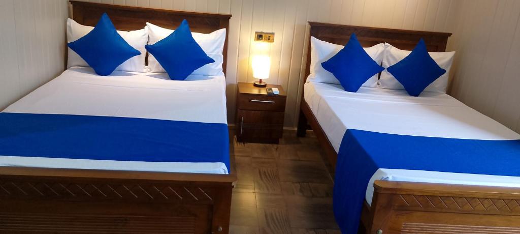 Postel nebo postele na pokoji v ubytování Ark Cabin Villa
