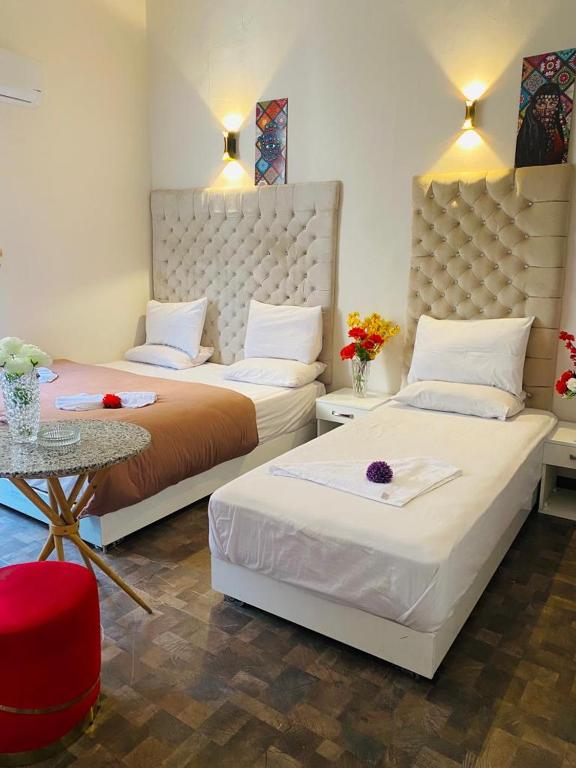 Postel nebo postele na pokoji v ubytování New Palace