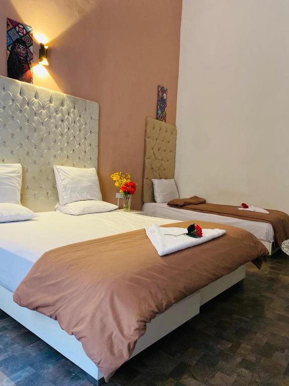 Postel nebo postele na pokoji v ubytování New Palace