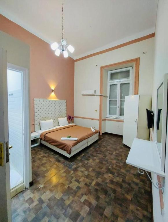 Postel nebo postele na pokoji v ubytování New Palace
