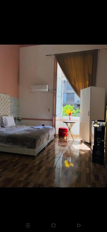 Postel nebo postele na pokoji v ubytování New Palace