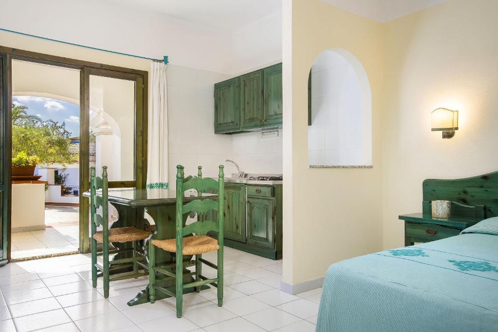 Postel nebo postele na pokoji v ubytování Alba Dorata Resort