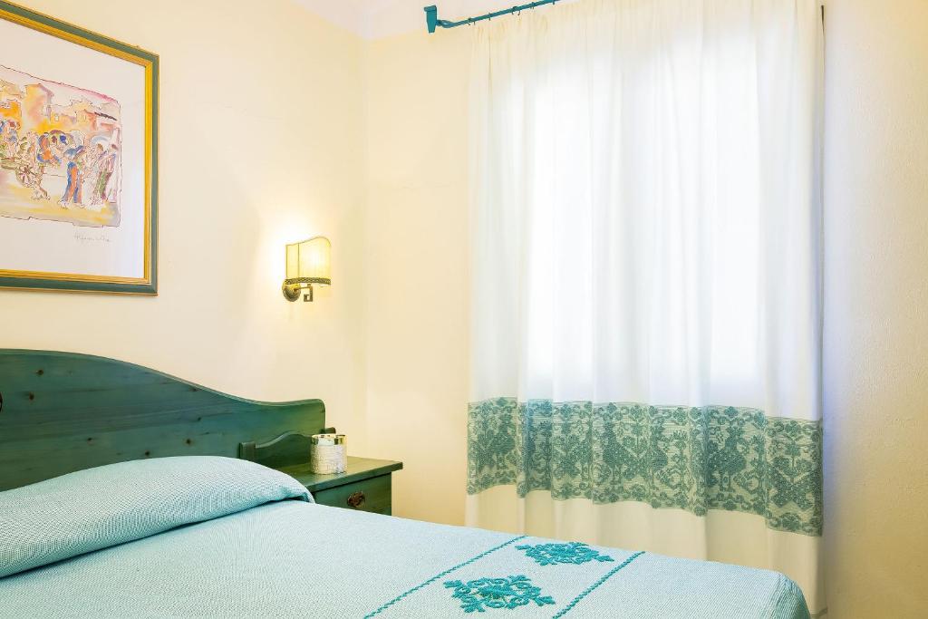 Postel nebo postele na pokoji v ubytování Alba Dorata Resort