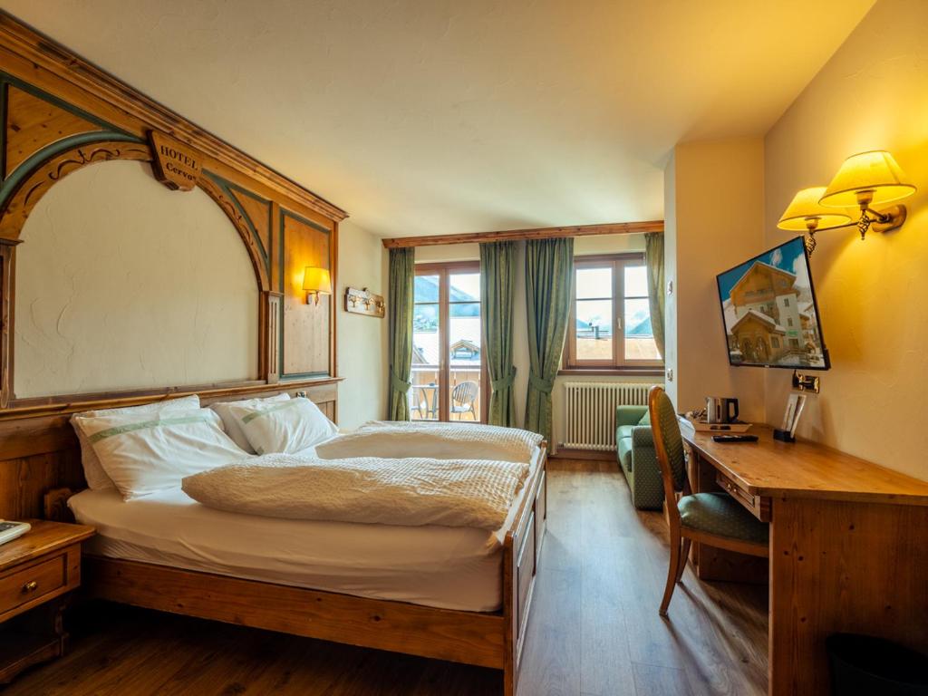 Postel nebo postele na pokoji v ubytování Hotel Cervo