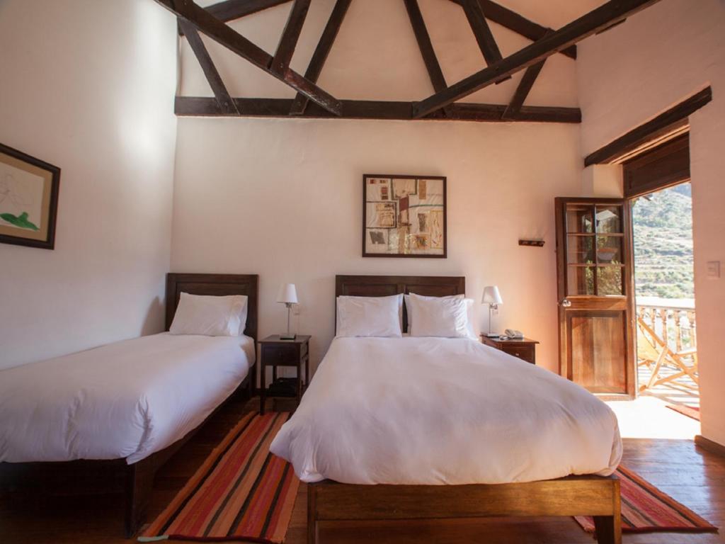 Postel nebo postele na pokoji v ubytování El Albergue Ollantaytambo