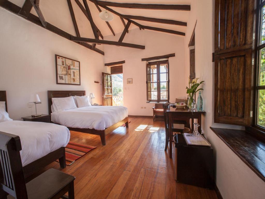 Postel nebo postele na pokoji v ubytování El Albergue Ollantaytambo