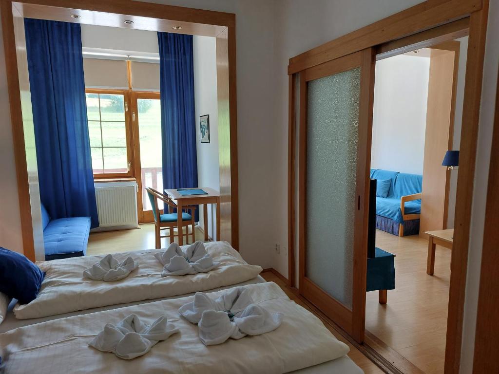 Postel nebo postele na pokoji v ubytování Hotel Gold