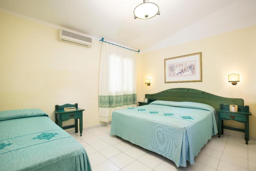 Postel nebo postele na pokoji v ubytování Alba Dorata Resort
