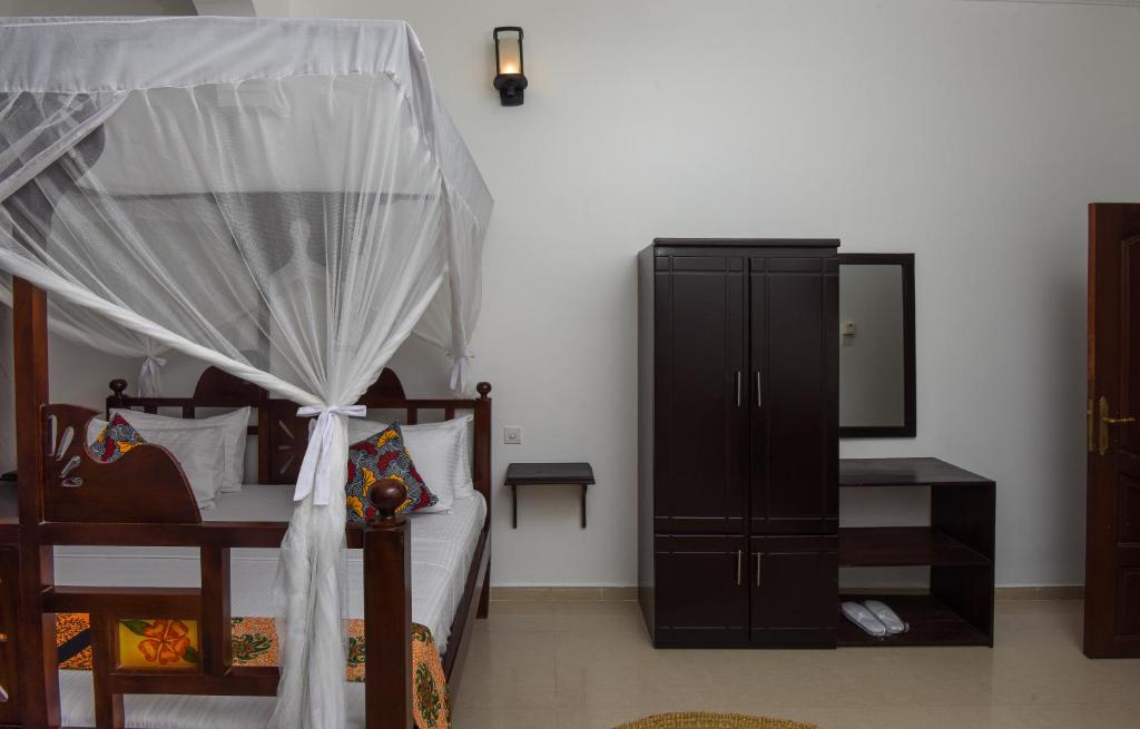 Postel nebo postele na pokoji v ubytování Zanzibar View Hotel