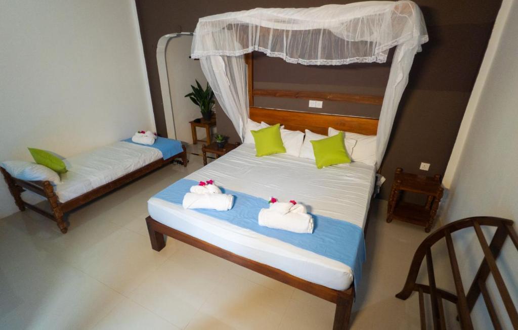 Postel nebo postele na pokoji v ubytování Sigiriya Cottage