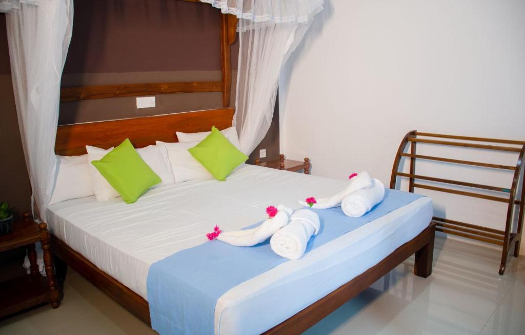 Postel nebo postele na pokoji v ubytování Sigiriya Cottage