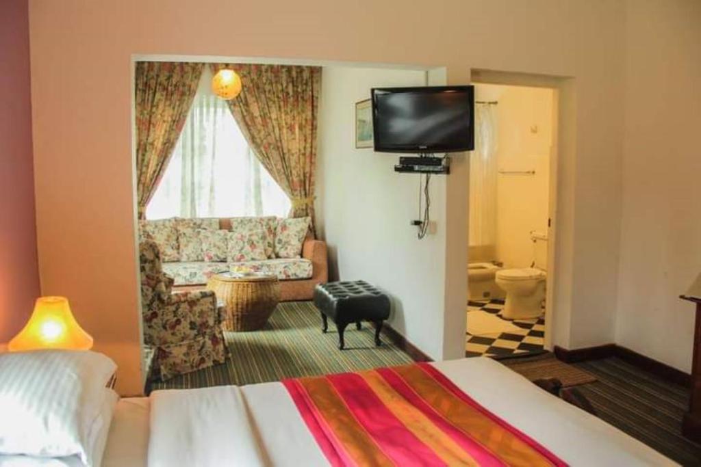 TV a/nebo společenská místnost v ubytování Hotel Glendower