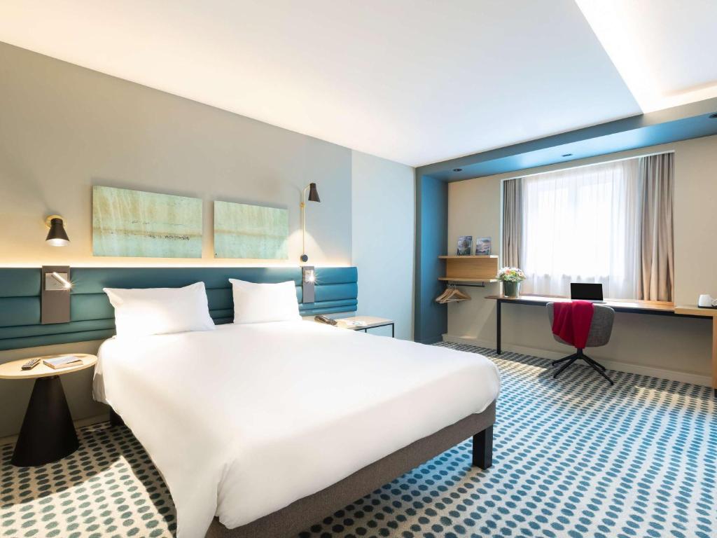 Postel nebo postele na pokoji v ubytování Novotel Luxembourg Kirchberg