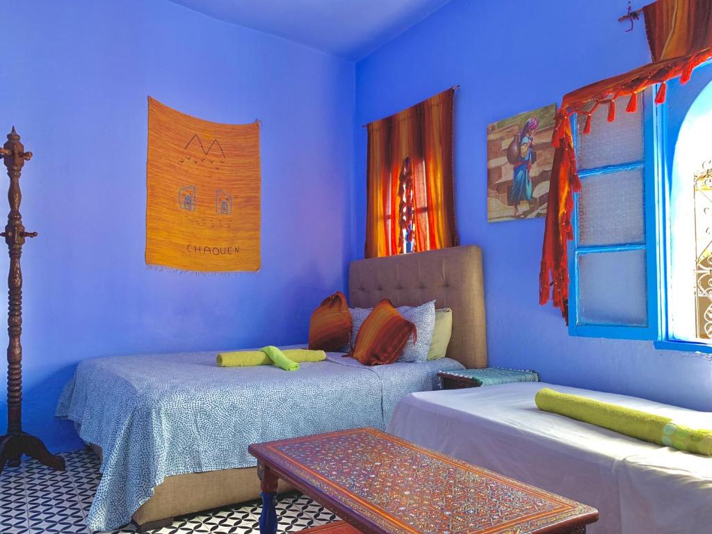 Postel nebo postele na pokoji v ubytování Hôtel Barcelona