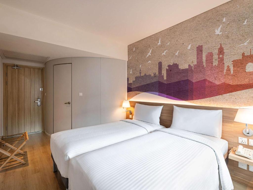 Postel nebo postele na pokoji v ubytování ibis Mumbai Vikhroli - An Accor Brand
