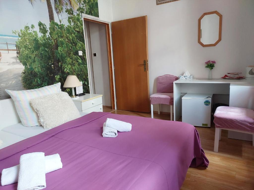 Rúm í herbergi á Hotel Asila