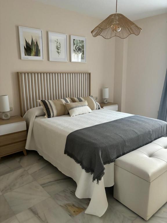 En eller flere senge i et værelse på Apartamento RondaSueña Centro