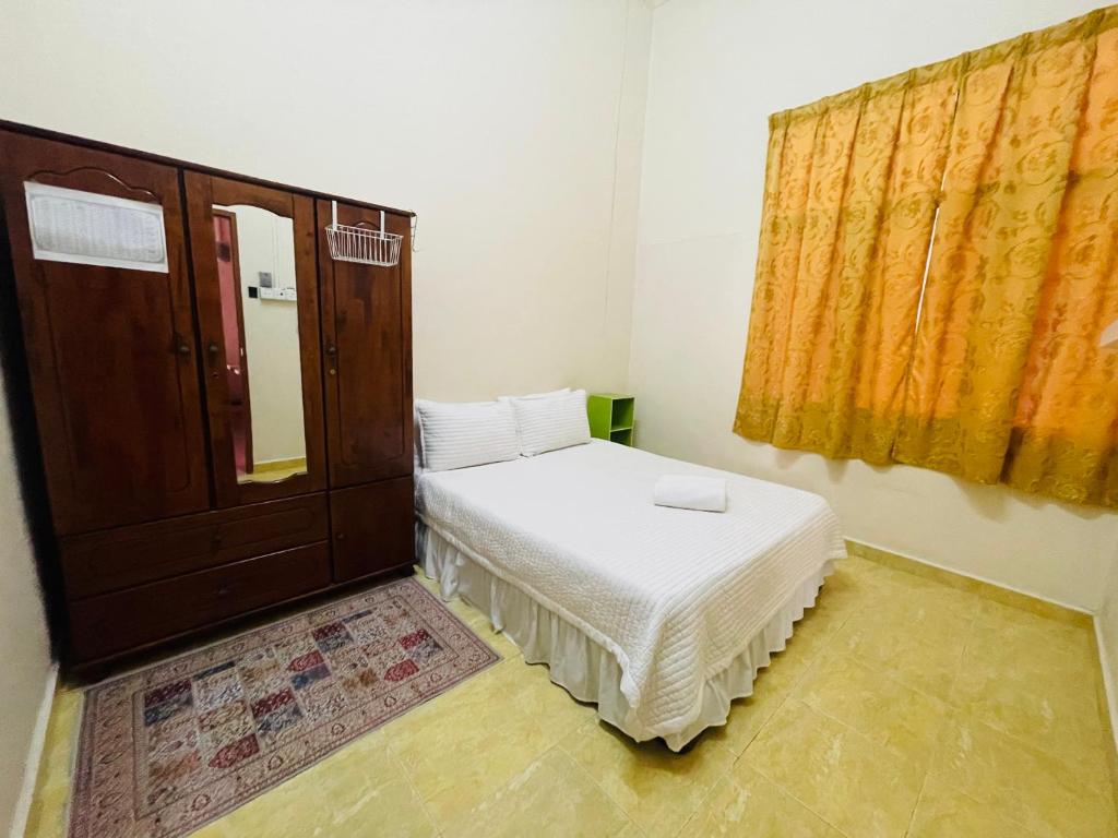 Postel nebo postele na pokoji v ubytování Kota Bharu Homestay
