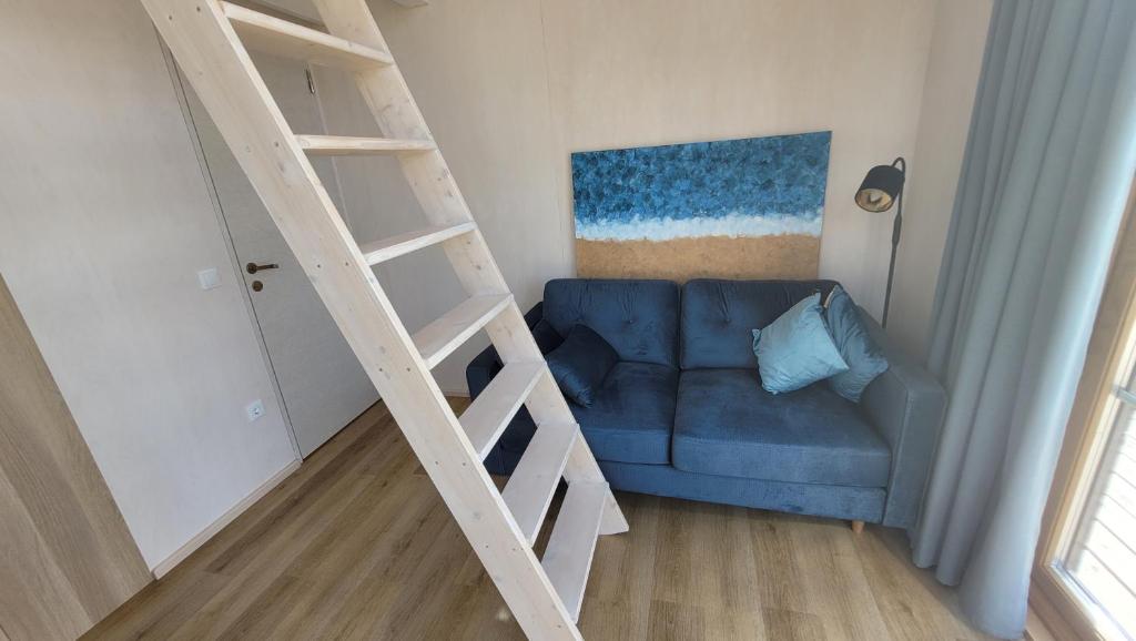 Postel nebo postele na pokoji v ubytování Seaside Tiny Maheri