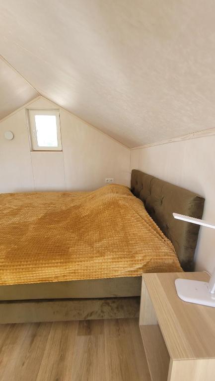 Postel nebo postele na pokoji v ubytování Seaside Tiny Maheri