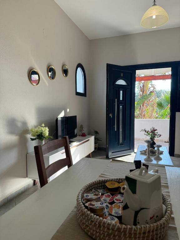 a living room with a table with a box on it at Sunset Apartments in Gourna