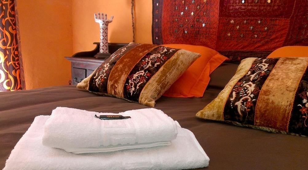 Postel nebo postele na pokoji v ubytování Las Cuatro Esquinas de Cáceres