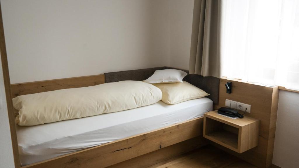Postel nebo postele na pokoji v ubytování Hotel Sterzinger Moos