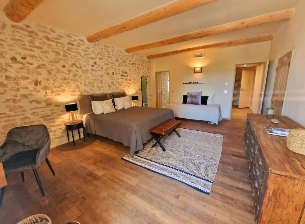 Postel nebo postele na pokoji v ubytování Bastide des 7 Sœurs