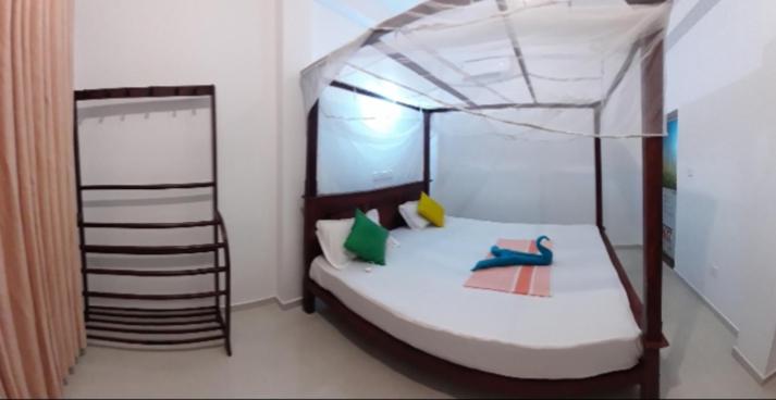 Postel nebo postele na pokoji v ubytování Sasagara Beach Villa