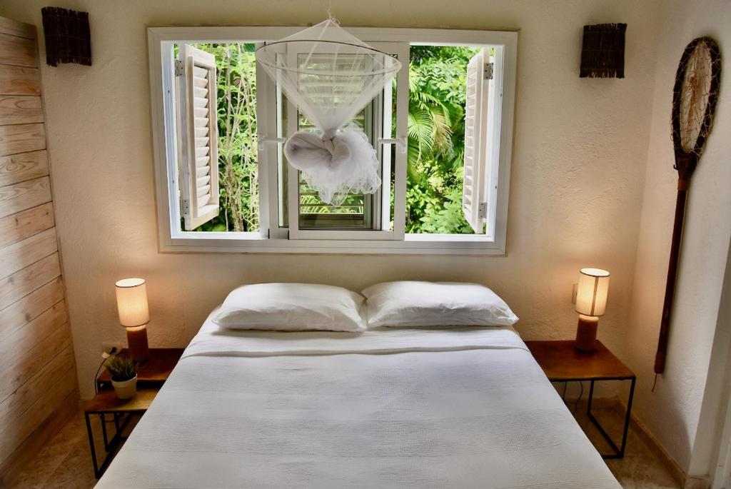 Una cama o camas en una habitación de JandalaVillage
