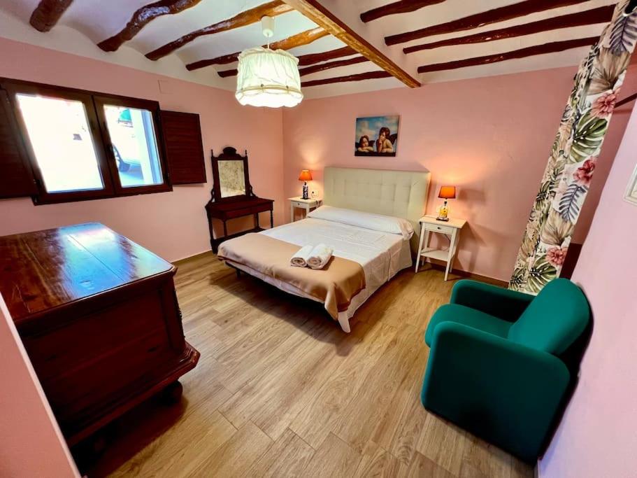 Postel nebo postele na pokoji v ubytování RAPIA Casa Rosa 1