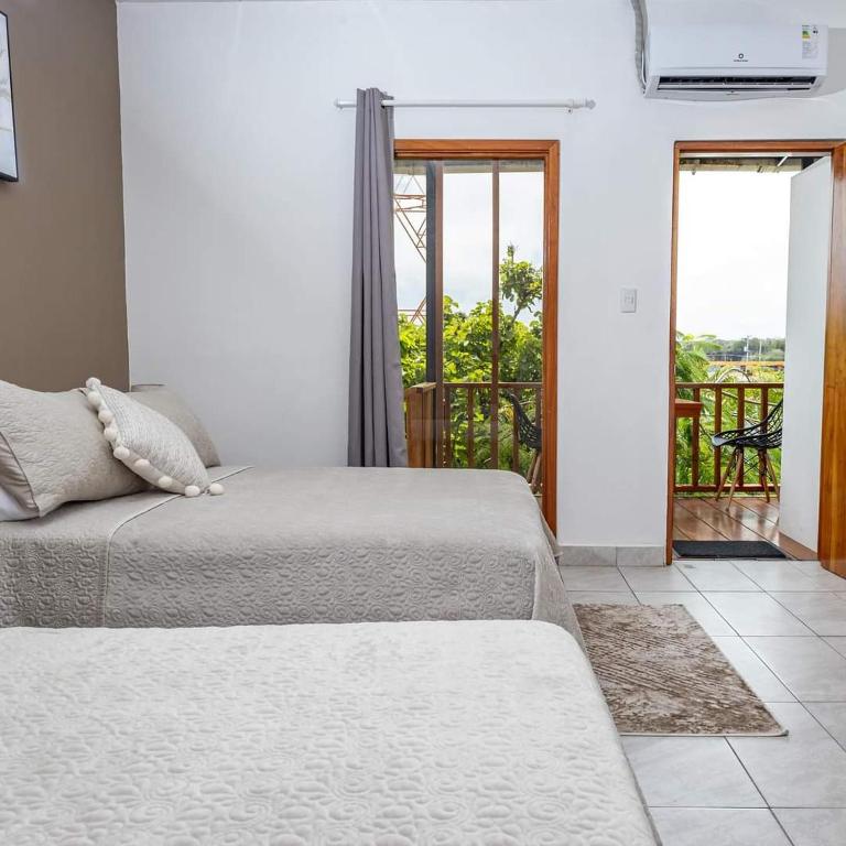 Postel nebo postele na pokoji v ubytování HOTEL AYRE By Baltra