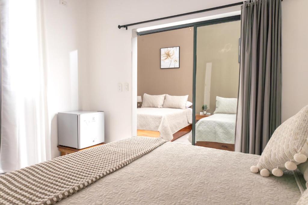 Postel nebo postele na pokoji v ubytování HOTEL AYRE By Baltra