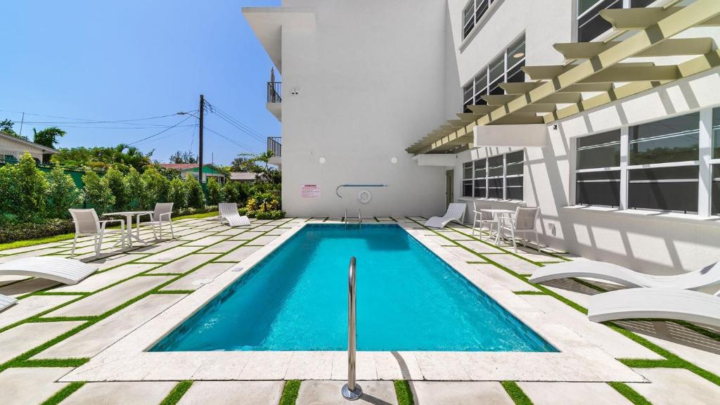 a swimming pool in the backyard of a house at Coral Beach 202 condo in Saint Peter