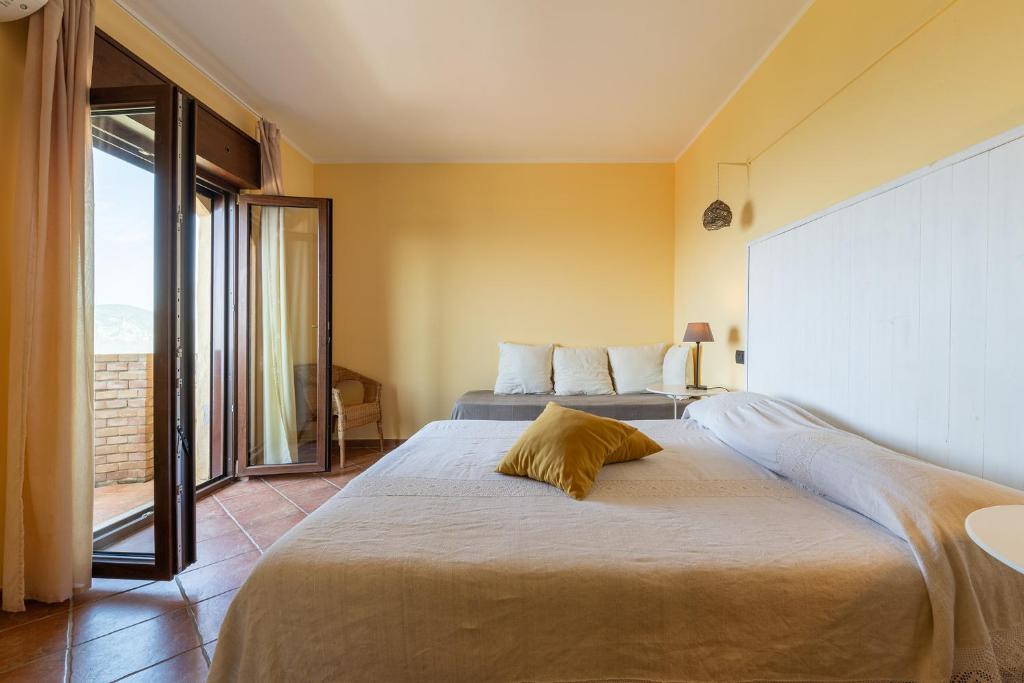 Postel nebo postele na pokoji v ubytování B&B Pedra Rubia