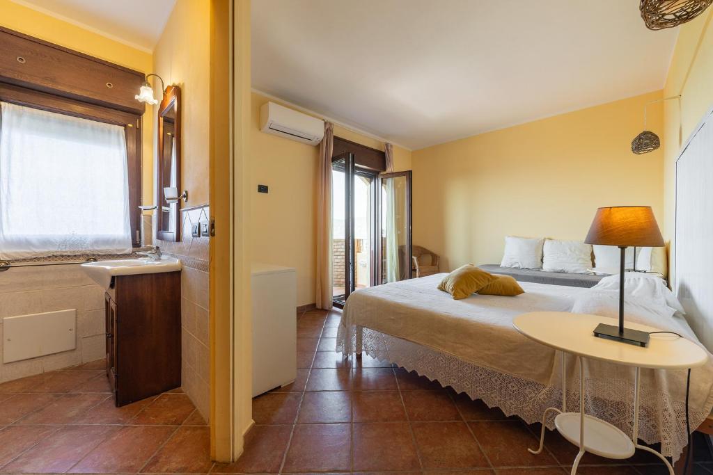 Postel nebo postele na pokoji v ubytování B&B Pedra Rubia