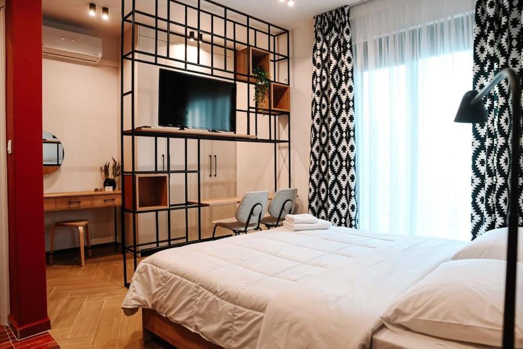 Ένα ή περισσότερα κρεβάτια σε δωμάτιο στο Four Stay Apartments Red Room